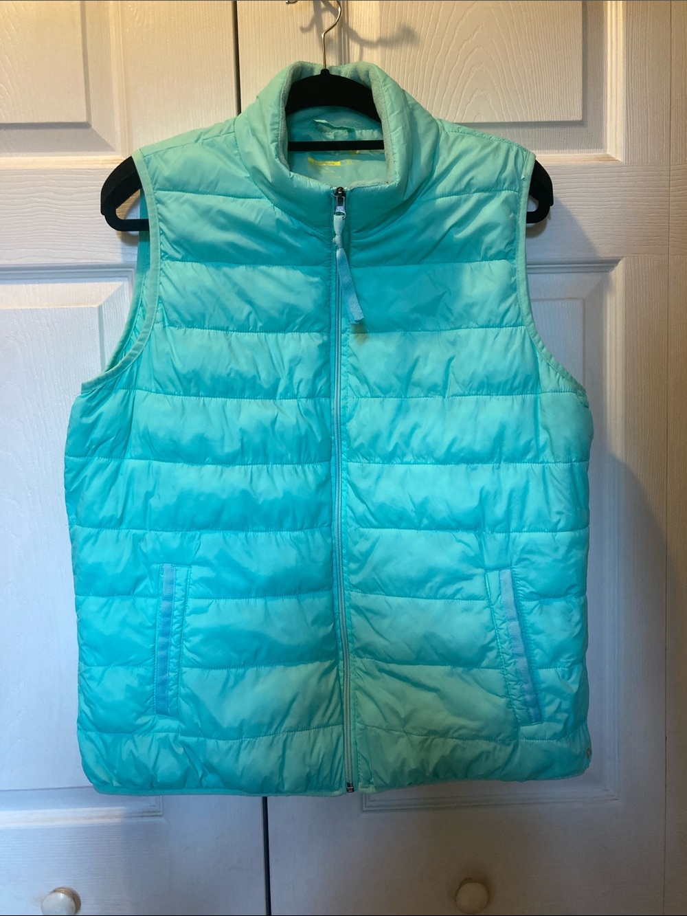 Aqua colored quilted Vest . Size XL